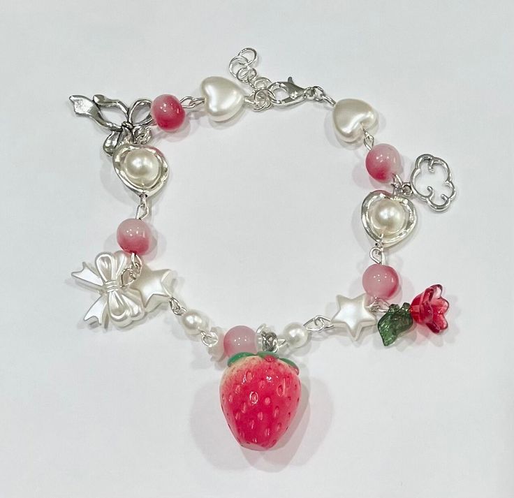 This bracelet is handmade. It is a strawberry themed bracelet with a large strawberry and rose.  2 Available Softie Jewelry, Kawaii Accessories Jewelry, Coquette Bracelet, Strawberry Accessories, Bracelet Coquette, Strawberry Coquette, Strawberry Bracelet, Strawberry Stuff, Kawaii Bracelet