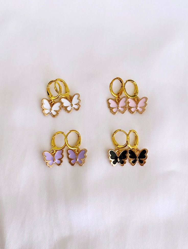 ♥ These cute "Love Bug" earrings are a must have! They come in purple, white, pink, and black!  ♥Pair it up with the "Love Bug" Necklace! ♥MATERIAL -16K gold plated over brass -nickel-free, hypoallergenic, tarnish-free Plated jewelry is a wonderful, affordable way to add a sophisticated look to your wardrobe, with the look of real gold. It is also an excellent choice for people with sensitive skin. ♥CARE TIPS - Avoid contact with perfumes, body oils, and other chemicals, including household cleaners. Never use chemical jewelry cleaners as these will do more harm than good. - For light cleaning, gently polish with a soft, lint-free cloth to avoid scratching. - Store it in a cool dry place. Cheap Nickel-free Hoop Huggie Earrings, Cute Butterfly Jewelry For Pierced Ears, Pink Heart Huggie Earrings For Pierced Ears, Pink Huggie Heart Earrings For Pierced Ears, Cute Adjustable Huggie Earrings, Purple Butterfly Earrings For Gift, Pink Butterfly Charm Earrings For Gift, Pink Butterfly Charm Earrings As Gift, Cute White Hoop Earrings For Gifts