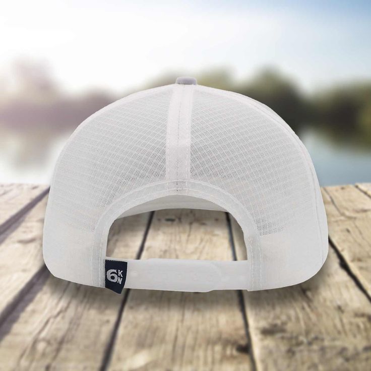 The ultimate water-resistant fishing accessory for avid tuna anglers is The Tuna Chaser hat. This stylish hat comes in a sleek white and gray color scheme and features a bold Six Knots Performance Fishing tuna badge on the front. Crafted with the highest quality materials, this hat is designed to keep you cool and comfortable all day long. The mesh back provides excellent ventilation, allowing air to flow freely and keep your head dry and sweat-free, even during those long and grueling fishing e White Breathable Sun Hat For Outdoor Activities, White Breathable Hats For Outdoor Activities, Breathable White Hat For Outdoor Activities, White Functional Hat For Outdoor Activities, White Visor Sun Hat For Outdoor Activities, Functional White Hats For Outdoor Activities, White Adjustable Breathable Trucker Hat, White Breathable Hat For Outdoor, Functional White Hats With Upf 50+