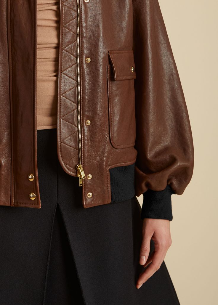 Description With pieces such as this buttery leather jacket, the Pre-Fall collection proposes a wardrobe that is both singular and universal. The shearling collared, zip- and snap-front silhouette combines the clean lines of a moto jacket with the softened volumes of a classic bomber. Finishing touches include a back yoke, patch pockets, and knit insets at the hem and cuffs. Details Material: Textured lamb (100% lambskin), lined in 100% cupro Care: Specialist clean Fit: Designed for an oversized Luxury Leather Jacket With Zip Cuffs For Winter, Classic Biker Jacket With Padded Collar For Work, Designer Brown Outerwear With Zipper Closure, Luxury Outerwear With Contrast Collar And Long Sleeves, Luxury Leather Outerwear With Zip Cuffs, Luxury Brown Leather Jacket With Concealed Placket, Luxury Leather Jacket With Zip Fly For Winter, Luxury Leather Jacket With Padded Collar For Work, Luxury Collared Leather Jacket For Winter