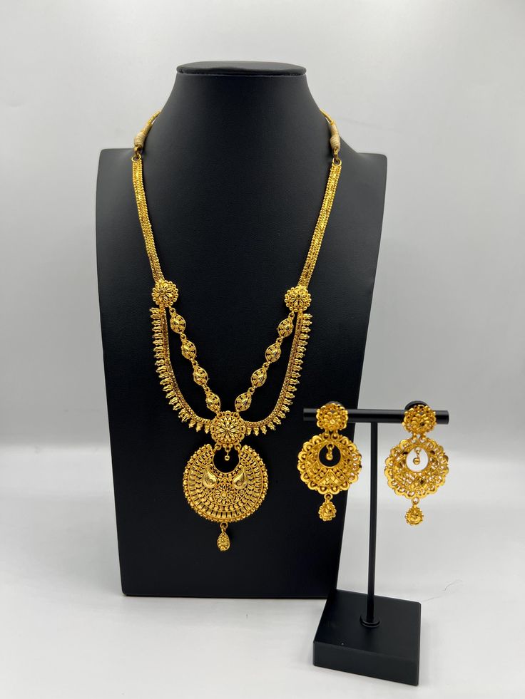 Indulge in the rich heritage of South Asia with our captivating necklace, a dazzling fusion of Indian, Pakistani, and Nepali influences. Inspired by the opulence of traditional jewelry, this exquisite piece showcases intricate craftsmanship and vibrant gemstones, reminiscent of royal adornments from the subcontinent. Embellish your neckline with its enchanting design, meticulously crafted to capture the essence of South Asian splendor. Elevate your style and embrace the cultural tapestry of Indi Traditional Gold Kundan Necklace With Elegant Design, Ornate Hand Set Gold Plated Jewelry, Ornate Hand-set Gold-plated Jewelry, Elegant Gold Dual-tone Kundan Necklace, Ornate Gold Plated Necklaces For Wedding, Gold Traditional Jewelry Sets For Formal Occasions, Ornate Gold Plated Necklace For Wedding, Formal Round Necklaces For Diwali, Elegant Dual-tone Chandbali Jewelry Sets