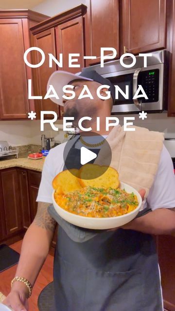 a man in an apron holding a plate with food on it and the words one pot lasagna recipe