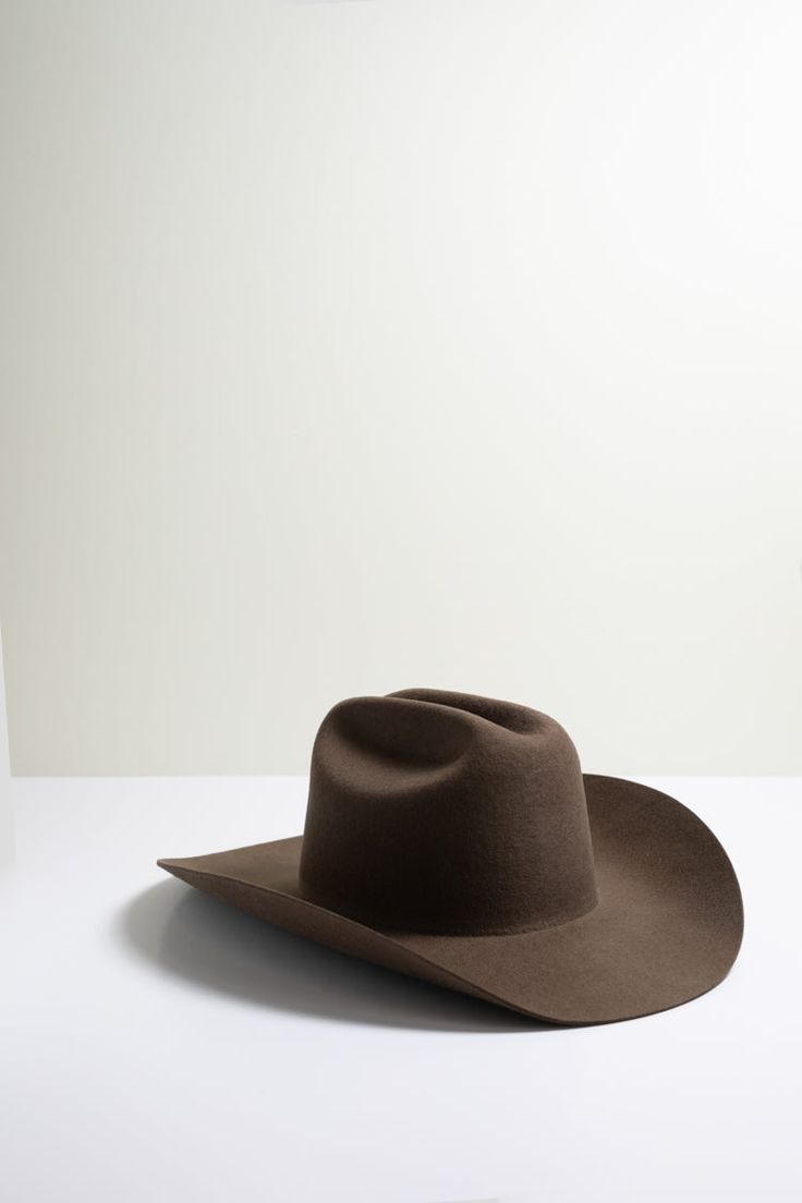 Classic. Cool. Totally on-trend. This brown, curled brim wool cowboy hat stands the test of time. Dress it up or down with the right mix of accessories from bands to feathers and pins. Details: 100-percent Australian wool Crown 4" Brim 4" Hidden adjustable band for fit flexibility See sizing chart Return policy Western Style Ranch Hat For Winter, Western Winter Hat Bands For Rodeo, Classic Top Hat For Western-themed Winter Events, Western Hats For Country Events In Winter, Classic Brown Felt Hat For Rodeo, Fitted Felt Hat For Rodeo In Fall, Western Style Felt Hat For Rodeo In Winter, Western Felt Hat For Rodeo In Winter, Western Wool Hat For Western-themed Events