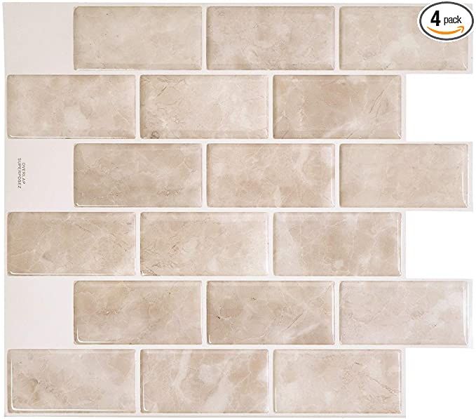 the back side of a white tile wall with several different shades of beige and cream