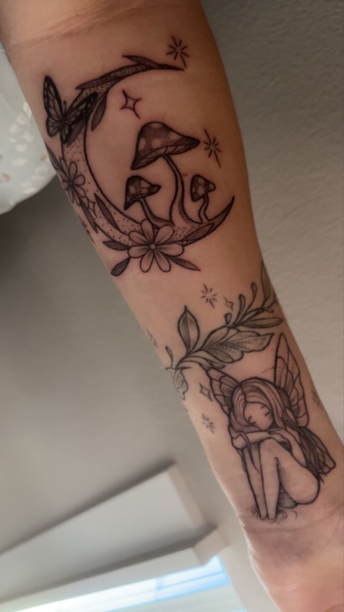 a woman's arm with tattoos on it and an image of a fairy sitting on the moon