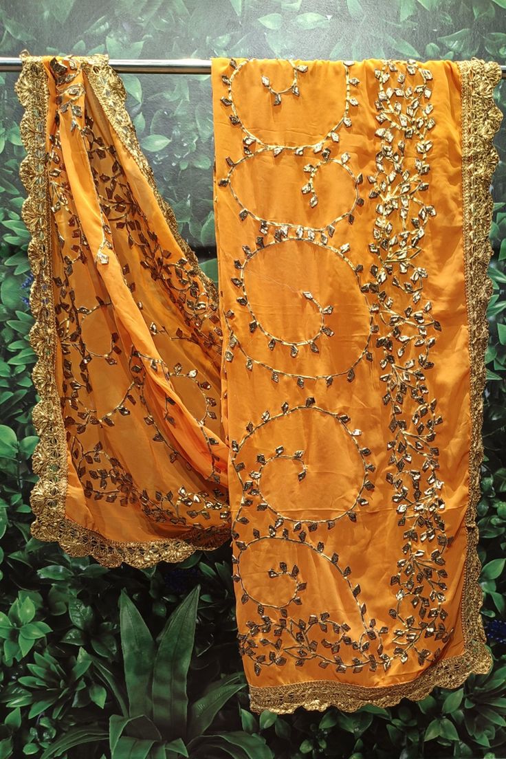 Dupatta Orange Dori Work Sharara, Orange Cutdana Sharara With Traditional Drape, Orange Sharara With Cutdana For Diwali, Unstitched Orange Sharara For Diwali, Orange Cutdana Sharara For Diwali, Festive Orange Sharara With Dupatta, Orange Sharara With Traditional Drape For Festive Occasions, Unstitched Orange Sharara With Traditional Drape, Festive Semi-stitched Orange Sharara