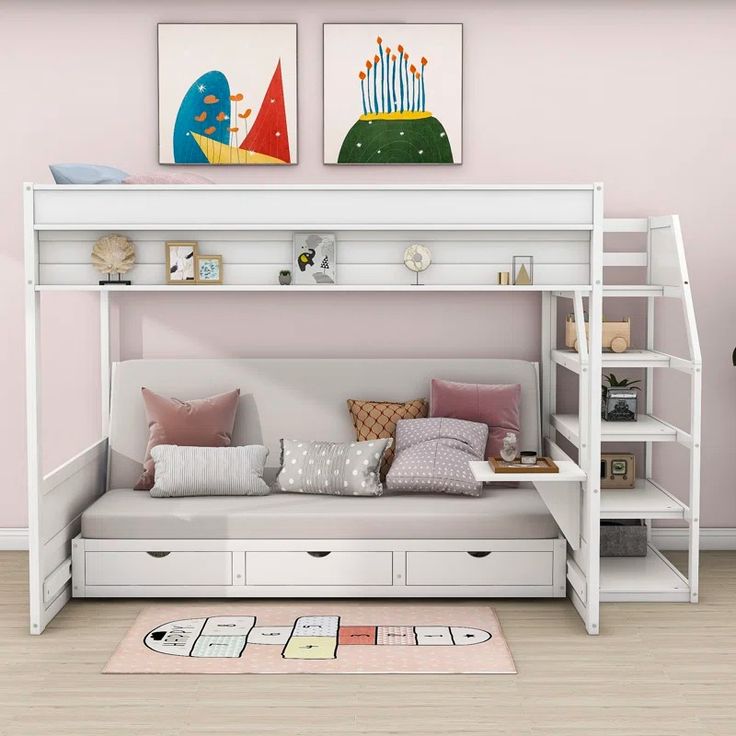 a white bunk bed sitting next to a pink wall