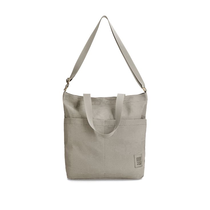 Introducing the Dirt Tote, a versatile carry that easily transforms for shoulder, crossbody, or backpack use. Ideal for the ride or on-the-go, made from 100% organic cotton canvas for pure comfort in this 3-way fit. The adjustable backpack straps and removable shoulder straps ensure convenience without extra weight. Secure your essentials with the snap closure main compartment, two front stash pockets for quick access, and an internal pocket featuring a key hook. Features & Specs Snap closure ma Cotton Shoulder Bag With Zipper For On-the-go, Functional Canvas Crossbody Bag For On-the-go, Versatile Canvas Bag, Versatile Shoulder Bag For Travel With Canvas Lining, Functional Everyday Canvas Backpack, Functional Standard Canvas Backpack For Everyday Use, Versatile Everyday Canvas Bag With Adjustable Strap, Versatile Double Handle Canvas Bag For Everyday Use, Versatile Canvas Bag For Everyday Use