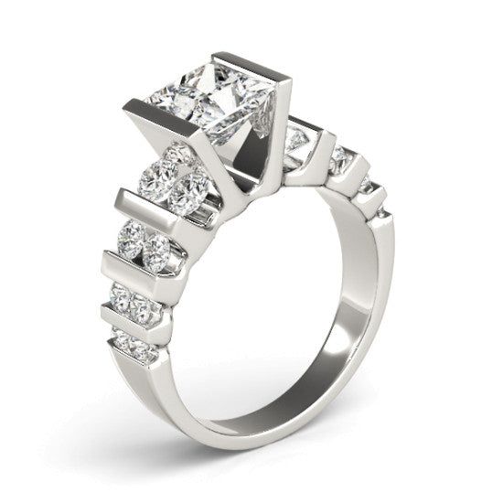 a three stone diamond ring with four princess cut diamonds on the sides and side stones