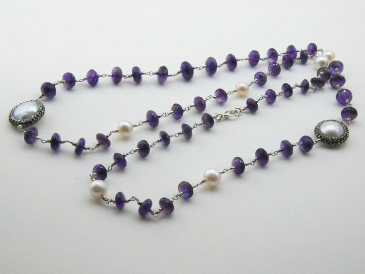 Amethyst is paired with a pearl in a necklace that is perfect for artists This is a stunning, natural necklace made from high-quality materials, amethyst, baroque pearls, Amethyst is associated with the Magical. Length 15 inç. ( 38 cm. ) Neck circumference 30 inç. (76 cm. ) Sending me requests and suggestions, please feel free to convo The product will be sent within a gift box and a gift bag For other inquiries, please visit the shop policies Thank you for visiting our shop http://www.etsy.com/ Elegant Wedding Pearl Necklace With Gemstone Beads, Elegant Amethyst Rondelle Jewelry, Purple Gemstone Necklace For Wedding, Elegant Purple Necklace For Wedding, Elegant Amethyst Rondelle Necklaces, Elegant Handmade Rondelle Pearl Necklace, Elegant Amethyst Rondelle Necklace, Elegant Pearl Necklace With Gemstone Beads For Anniversary, Amethyst Necklaces For Wedding