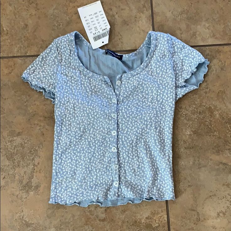 Super Cute Blue With Flowers Brandy Melville Shirt. Sent To On Accident, So Never Worn. No Flaws Light Blue Fitted Summer Shirt, Fitted Light Blue Summer Shirt, Fitted Light Blue Shirt For Summer, Blue Stretch Shirt For Summer, Blue Fitted Button-up Top, Blue Fitted Shirt For Spring, Light Blue Fitted Shirt For Spring, Fitted Light Blue Shirt For Spring, Trendy Blue Floral Print Shirt