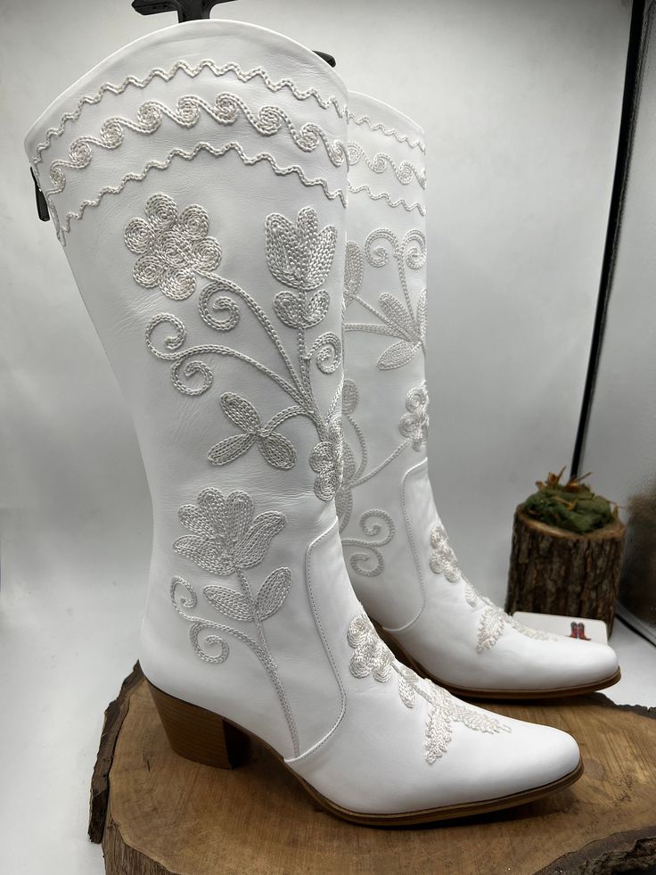 This is embroidery genuine leather custom made cowboy style suzani boots. There is every size available. Made with genuine leather, yok zipper. There is 2 inches, 5 cm heel. Knee high boots. If you need wider calf size please send us your calf circle measurments. Custom boots. Waterproof. Very comfy. We have door to door express shipping service. If you have any question please contact with us. bemyboots.etsy.com  Thank You White Leather Boots For Western-themed Events, Embroidered Snip Toe Boots For Rodeo, Western Style Embroidered Boots, White Snip Toe Mid-calf Boots For Western-themed Events, White Snip Toe Heeled Boots For Ranch, White Snip Toe Heeled Boots For Rodeo, White Round Toe Heeled Boots For Western Events, Fitted White Boots For Country Events, Western Hand Tooled Boots For Festivals