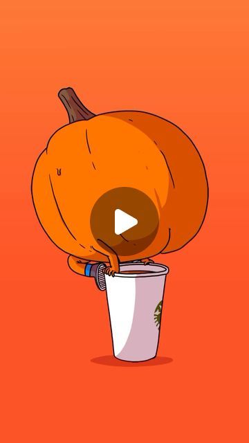 an orange pumpkin sitting on top of a cup with a video player in it's mouth