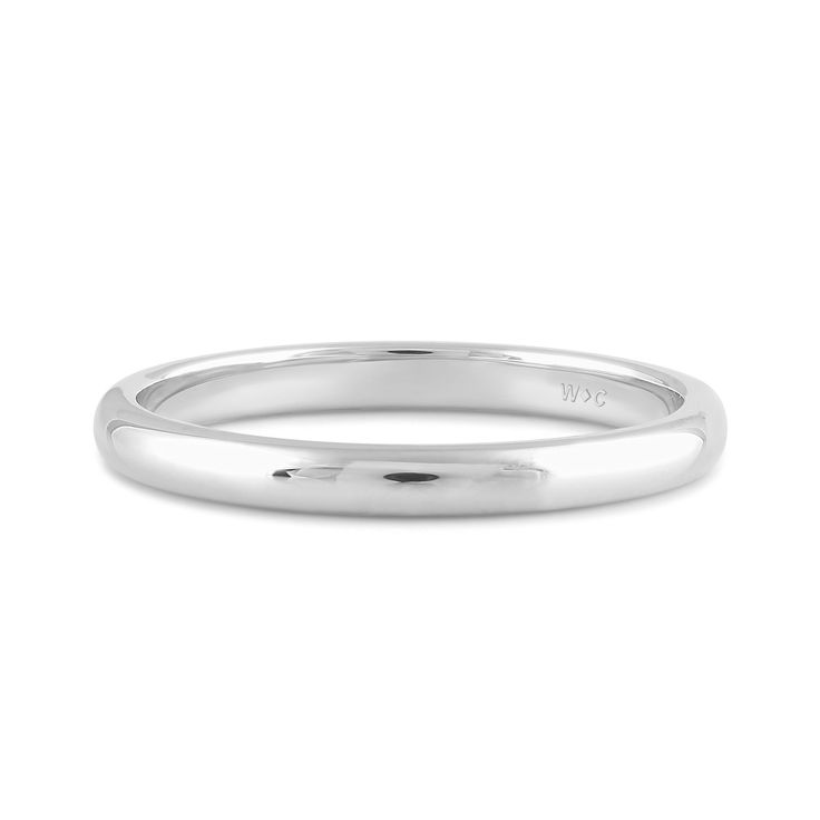 a white gold wedding ring on a white background