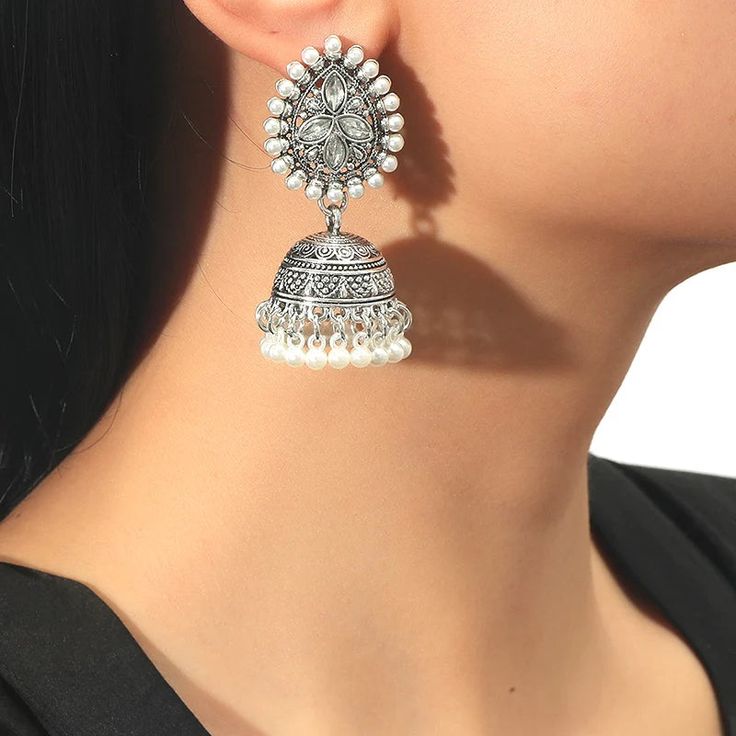 The versatile Cassie Jhumka Earrings are the ideal addition to any collection. Featuring just the right size and delicate details, these earrings can be dressed up or down to suit your style. Embrace their versatility and elevate any outfit with this must-have accessory. *This Product takes a Minimum of 30days to Ship* Diwali Drop Earrings Danglers, Chandbali Earrings With Latkans, Festive Drop Earrings Danglers, Festive Plug Earrings For Festivals, Festive Dangle Bridal Earrings, Festive Bridal Dangle Earrings, Diwali Pearl Chandbali Earrings, Festive Dangle Jhumkas, Diwali Chandbali Pearl Earrings