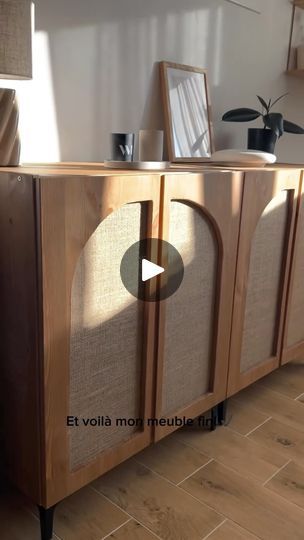 a wooden cabinet sitting on top of a hard wood floor