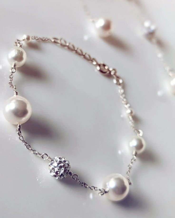 A simple, understated, beautiful bracelet made with high quality Swarovski pearls. The matching earrings are also available, this listing is for the bracelet only. Please see the links further below for the matching items. Available in 925 sterling silver (SS). The bracelet measure only 16.5cm in length + 2cm chain extension. The full length of the bracelet is 18.5cm. Most suitable for SMALL & MEDIUM wrist size. Please bear in mind that the pearls needs some space therefore the bracelet might no Elegant Bracelet Jewelry For Bridesmaid Gift, Sterling Silver White Gold Bracelets With Pearl Chain, White Gold Sterling Silver Bracelets With Pearl Chain, Formal Sterling Silver Pearl Drop Bracelet, Classic Silver Pearl Bracelet For Bridesmaids, White Gold Sterling Silver Bracelet With Pearl Chain, Dainty Sterling Silver Pearl Bracelet, Wedding White Gold Pearl Bracelet With Pearl Drop, White Gold Pearl Drop Wedding Bracelet