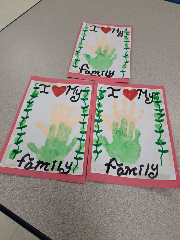 three handprinted cards with the words family and i love my family written on them