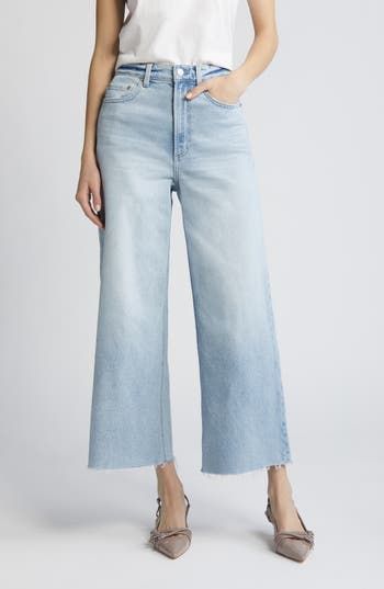 Frayed, ankle-grazing hems amp the '70s-meets-modern style of polished wide-leg jeans made from low-stretch denim. 27" inseam; 22 12" leg opening; 131/2" front rise; 15 1/2" back rise (size 29) Zip fly with button closure Five-pocket style 99% cotton, 1% spandex Machine wash, tumble dry Imported Fall Cropped Wide Leg Pants In Medium Wash, Fall Medium Wash Cropped Wide Leg Pants, Modern Light Wash Flare Jeans For Spring, Frayed Hem Cropped Wide Leg Pants For Fall, Modern Bottoms With Frayed Hem For Spring, Chic Wide Leg Pants With Frayed Hem For Spring, Cropped Wide Leg Pants With Frayed Hem For Fall, Spring Wide Leg Pants With Frayed Hem, Modern High Rise Flare Jeans For Spring