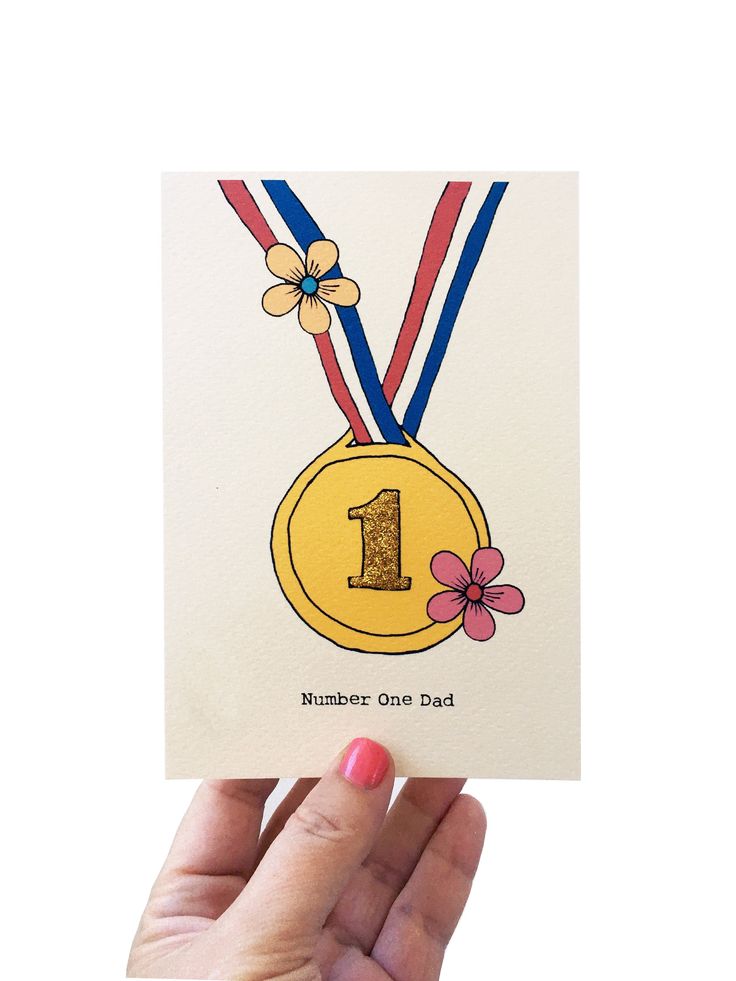 a hand holding up a card with a gold medal on it's neck and the number one