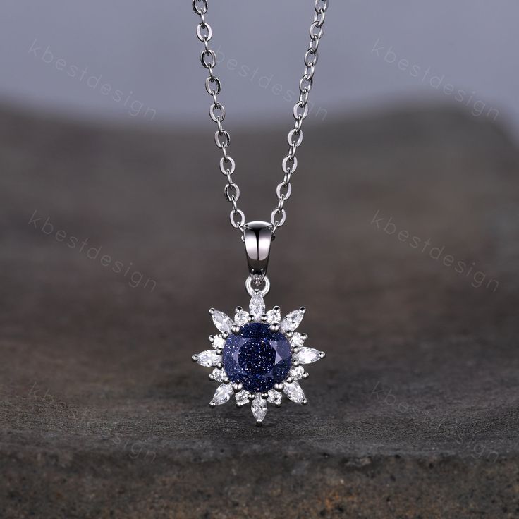 This beautiful Art Deco Galaxy Blue Sandstone Necklace features 1 carat round shaped center stone surrounded by Moissanite/Simulated Diamonds. For those who are looking for agate jewelry which is handcrafted in details, this unique agate necklace would be a perfect choice for you. Whether it be a Birthday gift for her, an anniversary gift her, or a celebration of yourself, this agate jewelry is the perfect gift from the heart. Alexandrite necklace: www.etsy.com/listing/1337968988/1ct-lab-alexand Fine Jewelry Sapphire Necklaces For Anniversary, Sapphire Jewelry With Moissanite Accent Stones, Sapphire Necklace With Prong Setting For Anniversary, Sapphire Necklace With Prong Setting For Wedding, Anniversary Sapphire Necklace With Prong Setting, Blue Round Stone Jewelry For Wedding, Fine Jewelry Sapphire Gemstone Necklaces, Round Wedding Necklace With Center Stone, Round Diamond Necklace With Center Stone For Wedding