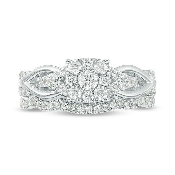 From this day forward, she'll adore this sparkling multi-diamond looped shank bridal set in white gold. Crafted in 14K white gold The engagement ring features a 1/10 ct. diamond in a squared diamond frame. The split shank is laced with gold loops to create a knotted look. A coordinating contoured diamond band completes the ensemble on your wedding day. This bridal set is radiant with 5/8 ct. t.w. of diamonds. Round Cut Diamond Bridal Set With Accents, White Gold Cubic Zirconia Bridal Sets, Dazzling White Bridal Sets, Diamond White Brilliant Cut Bridal Sets In Fine Jewelry, Diamond White Brilliant Cut Bridal Sets, White Gold Brilliant Cut Diamond Bridal Sets, White Gold Diamond Bridal Sets With Prong Setting, White Gold Diamond Bridal Sets Brilliant Cut, Diamond White Bridal Sets With Round Cut Diamond