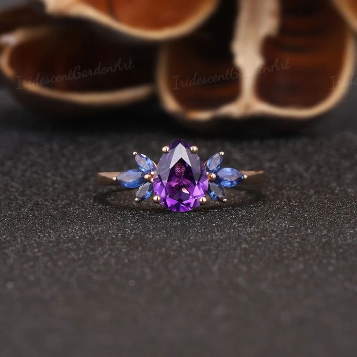 Unique Amethyst Engagement Rings Marquise Sapphire Wings | Etsy Cluster Diamond Gemstones For Wedding, Elegant Purple Multi-stone Sapphire Ring, Elegant Multi-stone Amethyst Wedding Ring, Purple Multi-stone Sapphire Ring, Formal Purple Sapphire Rings, Elegant Cluster Gemstones For Wedding, Elegant Purple Multi-stone Cluster Ring, Purple Pear-shaped Ring With Prong Setting, Formal Purple Gemstone Cluster Ring