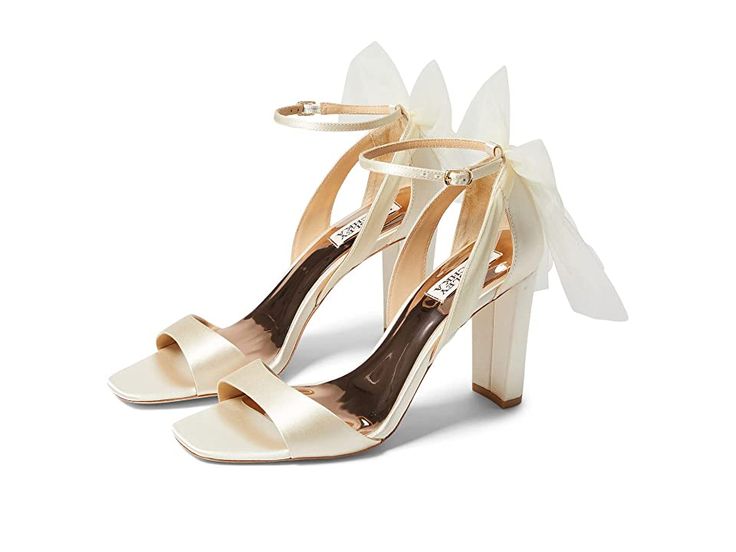 Badgley Mischka Kim - Women's Shoes : Ivory : Get the chic look wearing Badgley Mischka Kim shoes. Upper textile. Synthetic lining. Synthetic insole. Embellished evening shoe. Strappy sandal. Buckle closure. Leather sole. Imported. Measurements: Heel Height: 3 1 2 in Weight: 9 oz Product measurements were taken using size 9, width M. Please note that measurements may vary by size. Weight of footwear is based on a single item, not a pair. Wedding Sandals With Heel Strap In Synthetic, Wedding Sandals With Heel Strap In Synthetic Material, Wedding Sandals With Heel Strap, Elegant Fabric Heels For Formal Occasions, Elegant Open Toe Fabric Heels, Elegant Fabric Heels With Heel Strap, Elegant White Heels With Cushioned Footbed, Elegant Closed Toe Fabric Heels, Fabric Ankle Strap Heels For Evening