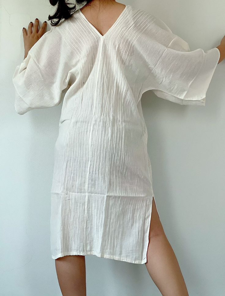 "Cotton Dress V Neck, Cotton dress, White Tonic, White Midi Kaftan, Midi dress, Loungewear, Summer dress White Tonic, White Midi Kaftan, Midi dress, Tunic Beachwear, Loungewear, tunic, Summer dress, Resort wear, Resort kaftan, White dress - 100 % COTTON -- extra lightweight - ONESIZE * Bust / Waist / Hips Circumference 52\" * Arms open up to 20 in. * Length 35\" * V-Neck * Side slits * No pocket * Slipover style * All above measurement are flat ♥ PAYMENT We accept payments via PayPal only. ♥ Shi White V-neck Loungewear Dress, White V-neck Midi Dress For Vacation, White V-neck Boho Summer Dress, White Relaxed Fit Maxi Dress For Loungewear, White Split Neck Casual Dress, White Casual Dress With Split Neck, White V-neck Maxi Dress For Loungewear, White Relaxed Fit Cover-up For Loungewear, White Knee-length Mini Dress For The Beach