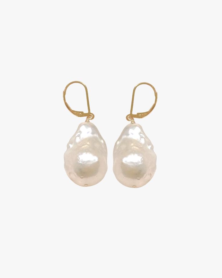 Product Description Add a touch of glamour in this stunning pair of large pearl earrings. Featuring large freshwater baroque and 14k gold-filled lever-back earring closure, she is perfect for that moment you want to feel bold. We use natural freshwater pearls to craft this item where there's a slight difference in the shape and size of each pearl. Just as no two pearls are identical, there's no one else quite like you in this world. …………………………………. D E T A I L S Sold as a pair Pearl measures 15-18 mm x 20-23 mm Closure type: French lever back Tarnish-resistant, showerproof, and safe for sensitive ears Lead-free, nickel-free, cadmium-free Material: 14K Gold Fill and freshwater fireball pearl Elegant Pearl Earrings With High Luster For Evenings, Luxury Pear-shaped Earrings For Evening, Luxury Pear-shaped High Luster Pearl Earrings, Luxury High Luster Pear-shaped Pearl Earrings, Luxury Pearl Drop Earrings For Evening, High Luster Drop Earrings For Evening, Luxury Teardrop Pearl Earrings, Glamorous Pearl White Jewelry With Pearl Drop, Elegant White Pearl Charm Earrings