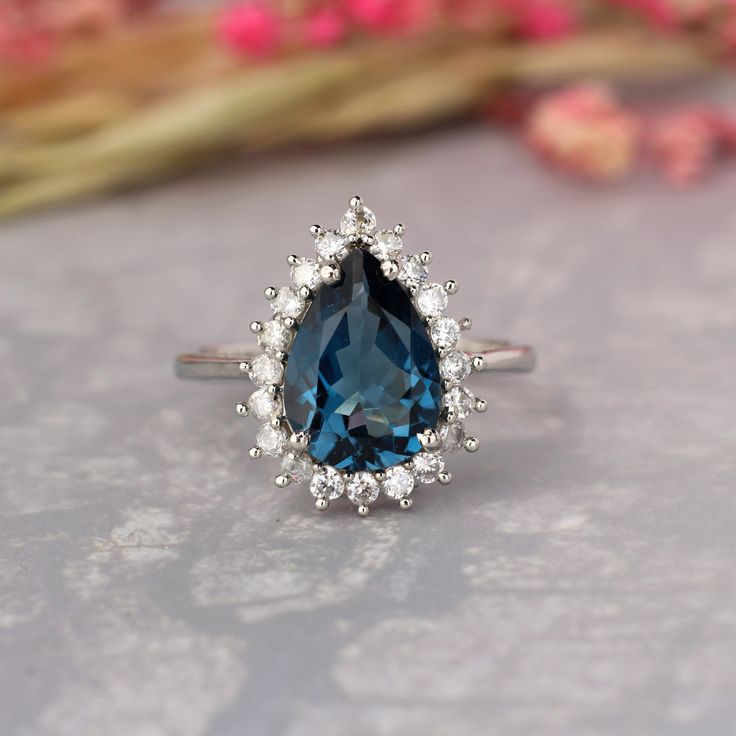 Item No: skj.33.955 Item: Natural London Blue topaz art deco Ring In 925 Sterling Silver Primary stone: London topaz Secondary Stone:-- zircon Article Weight:2.8 gm primary stone Size : 8x12mm Ring Length:2cm Ring Width:0.5cm Maintenance Tips 1.Keep the jewelry away from direct heat, water, perfumes, deodorants, and other strong chemicals.  2.Wipe the Jewelry gently with a chamois cloth or leather swatch after every use.  3.Wiping the jewelry with a soft cloth after removing the jewelry would add to its life.  4.Preserve your Jewelry in the original box or in a soft cloth pouch** PAYMENT POLICY  PAYMENT THROUGH PAYPAL ONLY. SHIPPING POLICY Processing time for orders is 1-3 business days and they are shipped with DHL ecommerce standard shipping with 11-23 days delivery time .For Express shi Luxury Blue Topaz Crystal Engagement Ring, Luxury Blue Topaz Art Deco Ring, Luxury Dazzling Topaz Ring With Diamond Accents, Luxury Art Deco Topaz Rings, Elegant Sterling Silver Pear-shaped Topaz Ring, Elegant Silver Pear-shaped Topaz Ring, Elegant Pear-shaped Topaz Ring In Sterling Silver, Elegant Teardrop Topaz Ring In Sterling Silver, Teardrop Topaz Ring For Anniversary