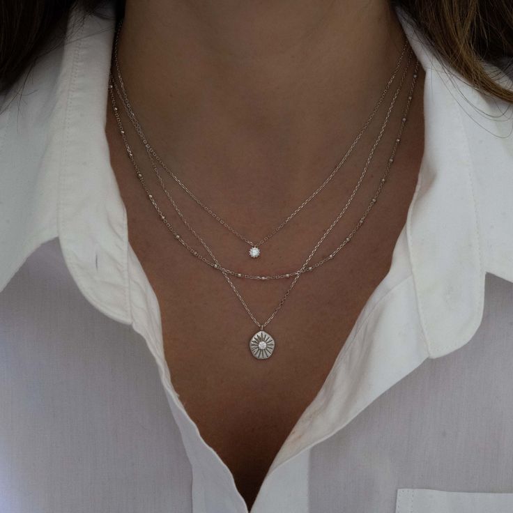 This delicate beaded chain necklace is a must-have staple piece! It's great for layering, but also adds a sweet minimalist touch to any look. Made of 925 Sterling Silver 14K Gold or Rhodium plating Nickel-free & Hypoallergenic Lengths include 3" extender Lobster clasp closure Matching bracelet available! Everyday Silver Necklace, Silver Jewelry Layering, Necklace Layering Ideas Silver, Necklace Layering Silver, Layering Necklaces Silver, Simple Beaded Necklace, Thrift Manifest, Layered Necklace Silver, Silver Layered Necklace