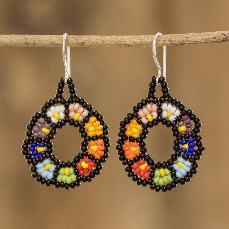 Czech glass beads become a work of art in the hands of Guatemalan artisan Mirian Zet, who designs and crafts this beautiful pair of multicolored floral dangle earrings guaranteed to make you shine. The earrings feature sterling silver hooks and are a must for those who love the delicacy of flower-shaped accessories. Ad Earrings, Buy Bead, Stitch Ideas, Beaded Dangle Earrings, Brick Stitch, Beaded Dangles, Bead Weaving, Czech Glass Beads, Hook Earrings