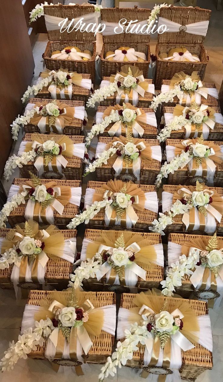 many baskets with flowers and ribbons on them