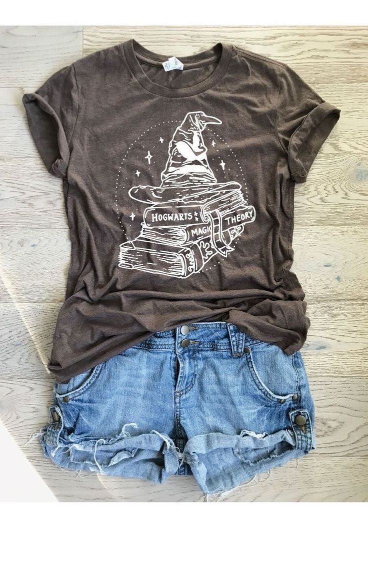 a t - shirt that says hogwarts is here on it and some shorts