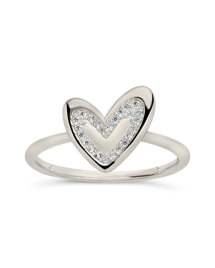 Our Mabel CZ Heart Ring is the perfect accessory for showing your heart some love. This sterling silver ring dazzles with the sweetest little heart, making it an ideal gift for showing someone special how much you care. Go on, show yourself some love — you deserve it! Materials: 14K gold plated sterling silver or sterling silver, cubic zirconia Features: 1.5mm band, 0.4" heart, 1mm CZ stones, Lead & Nickel free Heart-shaped Cubic Zirconia Rings For Mother's Day, White Gold Heart Promise Ring For Mother's Day, Mother's Day Promise Heart Ring In White Gold, Mother's Day Promise White Gold Heart Ring, Cubic Zirconia Heart Ring For Promise, Cubic Zirconia Heart Promise Ring, Heart-shaped Cubic Zirconia Promise Ring, Mother's Day Heart-shaped White Gold Rings, Silver Cubic Zirconia Heart Ring For Mother's Day