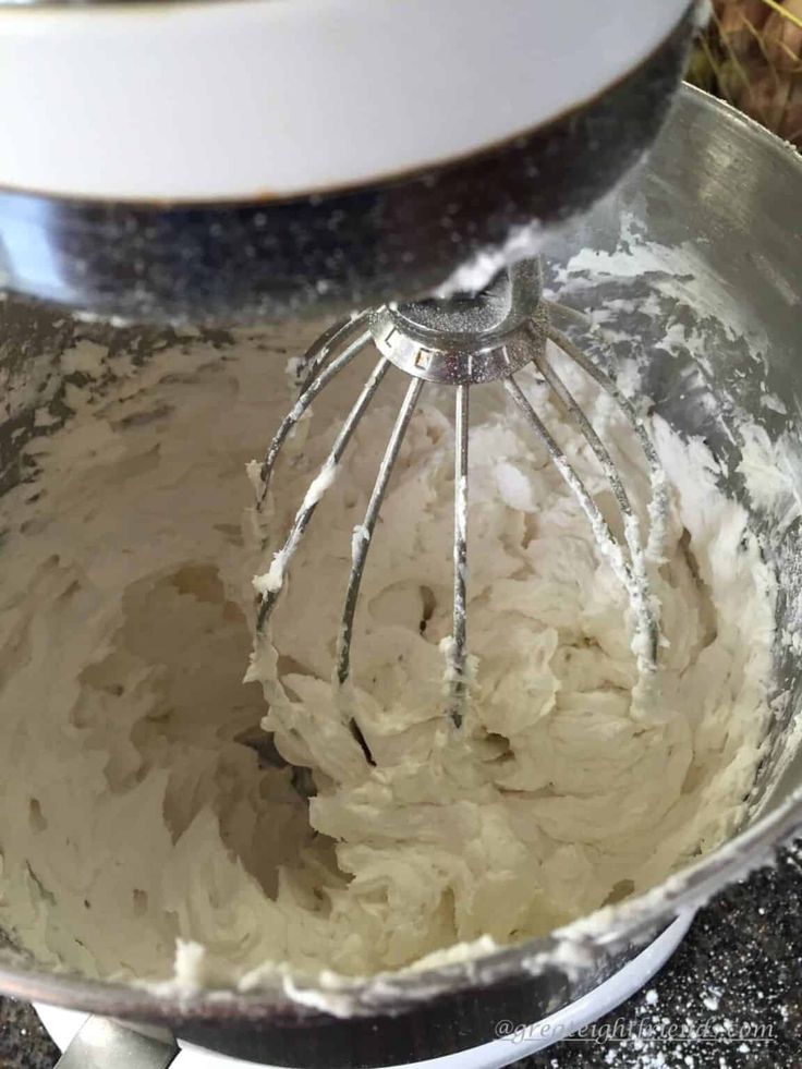 a mixing bowl filled with batter on top of a counter