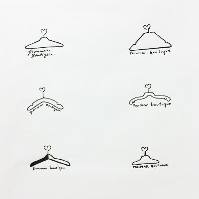 six different types of clothes hangers on a white wall