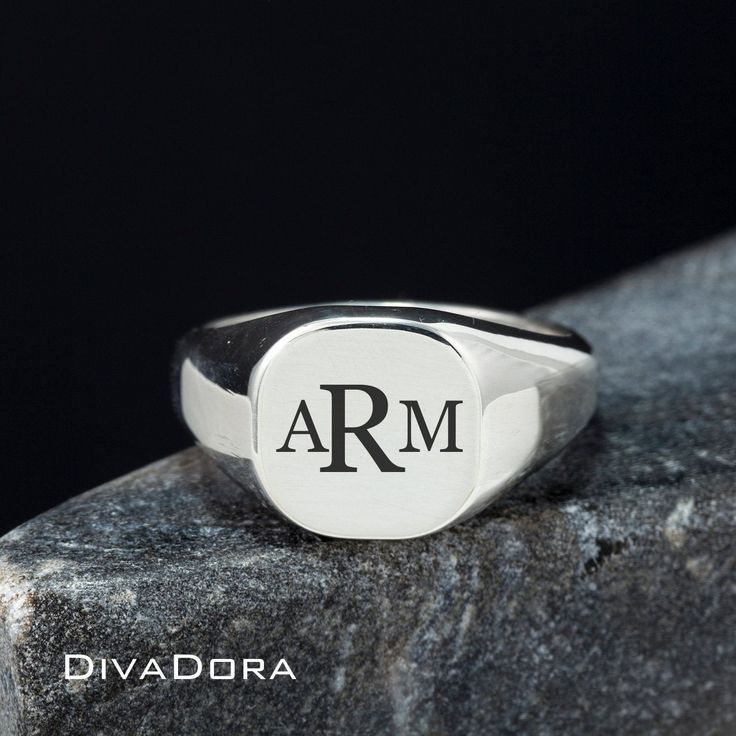 "We designed this signet ring with the look and feel of a true designer piece. The substantial weight of the solid 925 sterling silver and smooth curved edges make this a ring you will love to wear or gift with pride. We craft each piece to order and perform the laser engraving in our Los Angeles workshop. Since we control every step of the creation our team can craft a custom ring for you in only a few days! We can engrave the ring with a monogram, a single initial or work with you to create a Silver Stamped Symbolic Signet Ring, Silver Symbolic Stamped Signet Ring, Symbolic Stamped Signet Ring In Sterling Silver, Symbolic Sterling Silver Stamped Signet Ring, Symbolic Stamped Sterling Silver Signet Ring, Silver Modern Signet Ring With Engraving Option, Modern Silver Signet Ring With Engraving Option, Classic Silver Initial Ring As A Gift, Classic Silver Initial Ring For Gift