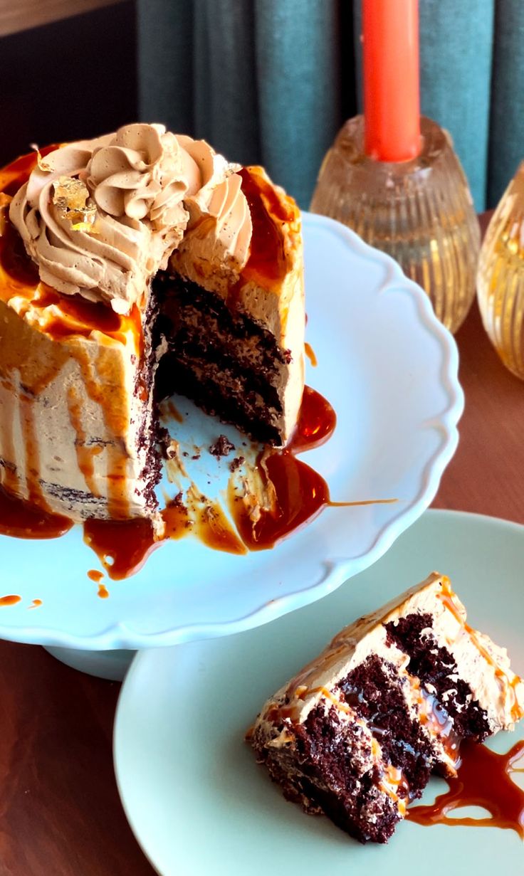 two pieces of cake on plates with one slice missing from the cake and another piece has been eaten