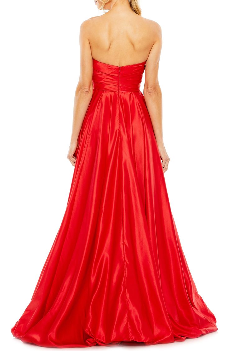 A satiny siren-shaded gown will cause a stir with a very swishy skirt and a strapless silhouette. 61" length Strapless Lined 100% polyester Spot clean Imported Asian Owned/Founded Taffeta Gown For Gala And Prom Season, Gala Gown With Satin Finish And Fitted Bodice, Strapless Satin Finish Evening Dress For Formal Occasions, Strapless Taffeta Evening Dress For Gala, Strapless Taffeta Sweetheart Neckline Prom Dress, Strapless Taffeta Prom Dress With Sweetheart Neckline, Satin Finish Evening Dress With Fitted Bodice For Gala, Strapless Taffeta Dress With Sweetheart Neckline For Evening, Strapless Gala Gown With Sweep Train