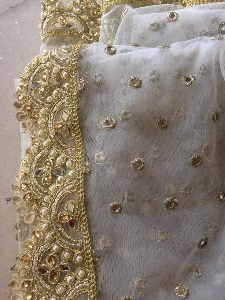 More dupatta here in our collection https://www.etsy.com/shop/neelcreations/?section_id=15880219 White with embroidery Indian dupatta. It has beautiful golden border. Scallop border with dull gold color. ★ The mirror is not real. ★ It can be made in other colors and longer in length also. We can also change the border if you want. Approximate length 88-90 inches. We can increase length so please contact us if you want longer dupatta. These designer dupattas are very much in trend. Pair them with Lace Choli With Sheer Dupatta For Party, Traditional Lace Choli With Sheer Dupatta, Festive Lace Work Lehenga For Navratri, Elegant Silk Thread Dupatta With Dori Work, Festive Lace Choli With Zari Work, Gold Chanderi Choli With Sheer Dupatta, Traditional Drape Choli With Lace Work For Diwali, Gold Organza Choli With Dupatta, Festive Organza Salwar Kameez With Lace Work