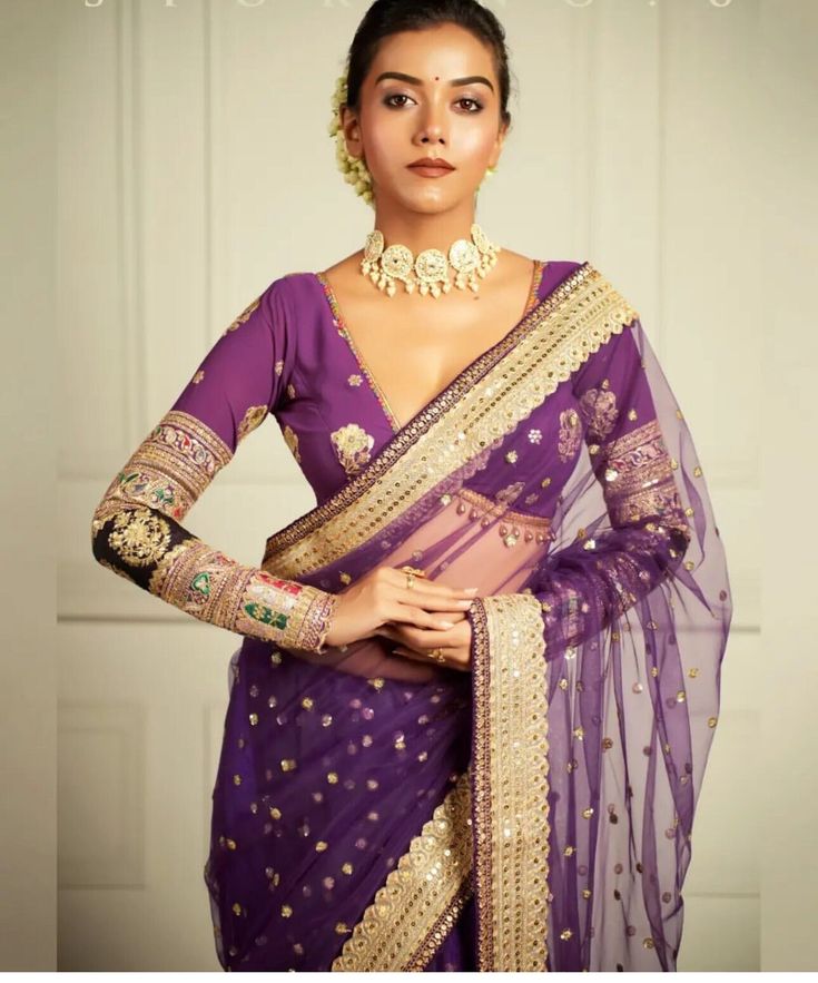 Made to Order Indian Saree Lehenga Designer Purple  Full Sleeves Blouse With Embroidered Georgette Fabric, Plunge Neck Custom Made Blouse This Made to Order/Made to Measurement/Custom Made Indian Ethnic Blouse. - Fabric - Embroidered Georgette - Color - black - Princess Cut - Rich Lined - Full Sleeves - Extra margin and extra stitches included in the blouse - It can be customize in any color, design or size  PLEASE NOTE: BUYERS ARE RESPONSIBLE FOR ANY CUSTOMS AND IMPORT TAXES THAT MAY APPLY. This is a made to order product. If you opt for 'Made To Measurement Option', we will provide a measurement template and you can share the measurements likewise. If you want to opt for 'Standard Size', Please refer to the size chart provided in the listing. Shipping: Standard Shipping is done by DHL ec Luxury Purple Self-design Blouse Piece, Festive Purple V-neck Sets, Purple Zari Work Choli, Designer Anarkali Purple Blouse Piece, Purple Choli With Zari Work, Bollywood Style Purple Choli With Long Sleeves, Purple Lehenga With Pallu, Purple Long Sleeve Bollywood Choli, Designer Purple Blouse Piece For Navratri