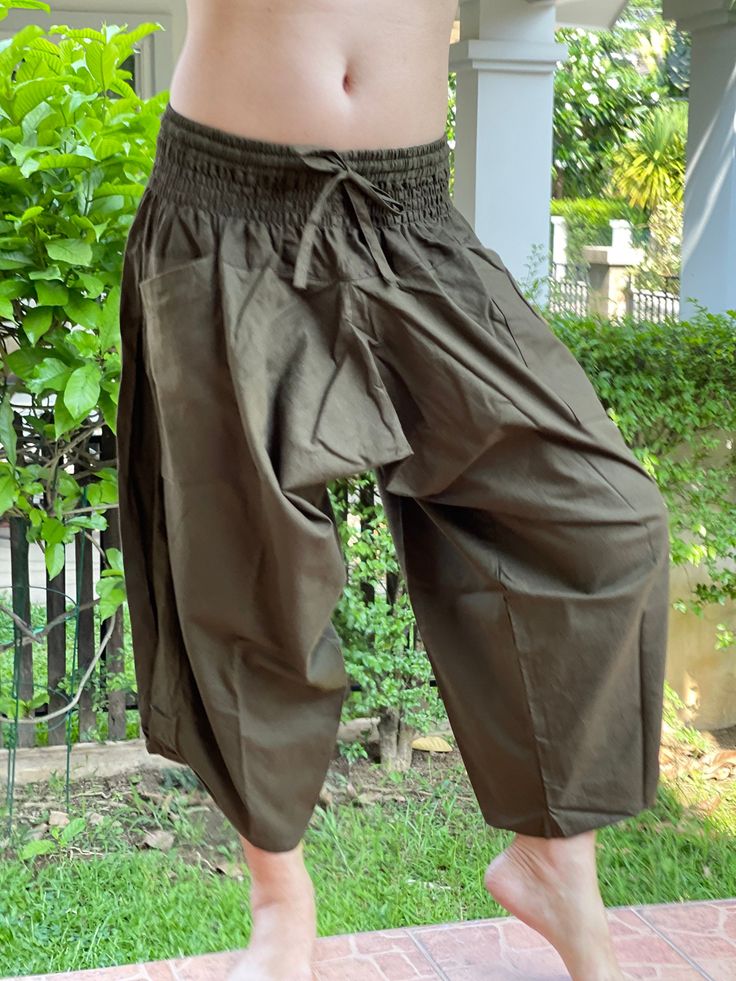 "Male Model Tall 5'9\" Waist 34\" Mens Japanese Samurai Style Japanese Casual, Harem Baggy Hakama cotton Pants Samurai Pants - elastic waistband Fits all! Unisex pants These beautiful casual pants is unique & comfortable to wear Handmade with a very lovely pattern, it is easy to wear and great for many occasions. One size fits most. These pants are great for many different activities like traveling, dancing, going to festivals, rock climbing, yoga, meditation, massage, working out, martial a Traditional Wide Leg Harem Pants For Meditation, Traditional Relaxed Fit Wide Leg Harem Pants, Traditional Harem Pants For Meditation, Traditional Yoga Pants With Pockets, Traditional Wide Leg Parachute Pants With Pockets, Traditional Wide-leg Parachute Pants With Pockets, Traditional Relaxed Fit Harem Pants, Traditional Long Harem Pants With Pockets, Traditional Brown Harem Pants