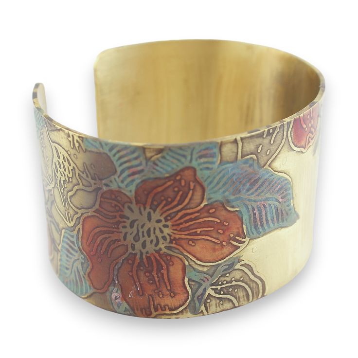 This Brass Botanical Cuff is like a ray of sunshine on your wrist! With its bright colors, it's sure to bring some extra warmth to your summer wardrobe. Plus, it's adjustable for the best fit, so you can make a style statement that's truly your own. Get your summer glow on! Cuff is sealed to ensure long lasting color; to ensure this protection please keep cuff out of contact with harsh soaps, chemicals, abrasive material or the water. Measurement:Depth (thickness of metal) = 0.04 inchesWidth = 6 Bohemian Cuff Bracelets For Spring, Bohemian Cuff Bracelet For Spring, Spring Bohemian Cuff Bracelet, Spring Bohemian Cuff Bracelet As Gift, Spring Bohemian Cuff Bracelet For Gift, Spring Bohemian Bangle Cuff Bracelet, Spring Adjustable Bohemian Cuff Bracelet, Adjustable Multicolor Cuff Bracelet, Spring Gift Adjustable Cuff Bracelet