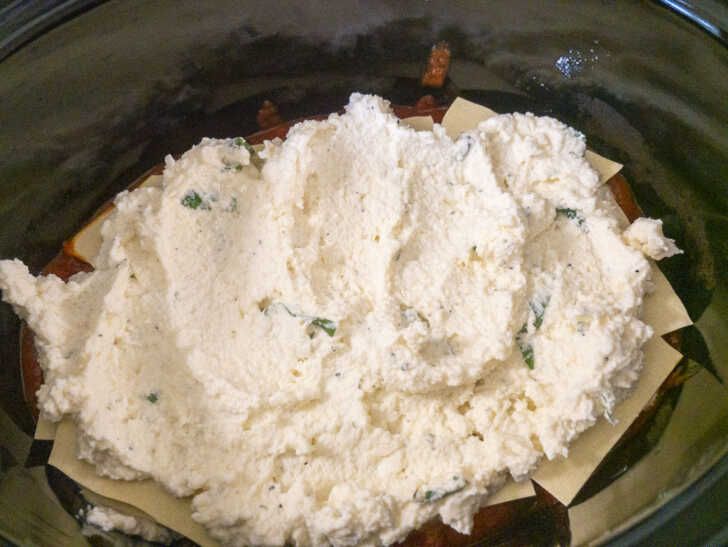 a bowl filled with food sitting on top of a table