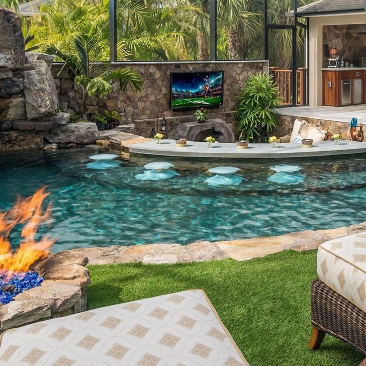 a backyard with a fire pit and pool