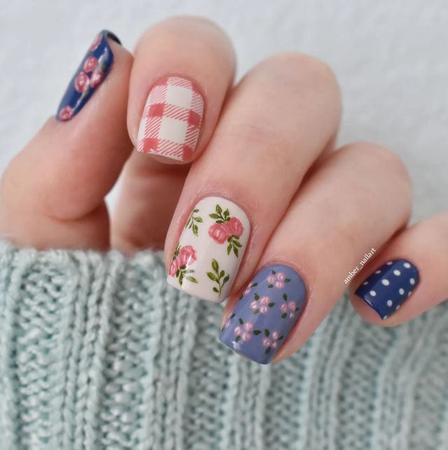 This whimsical design combines plaid and floral patterns with a mix of colors and textures, creating a unique and charming look. Fall Plaid Nails, Deep Red Nail Polish, Plaid Nail Designs, Deep Red Nails, Orange Nail Polish, Maroon Nails, Easter Nail Art, Red Polish, Home Classic