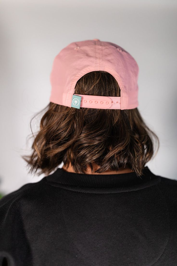 Add a touch of stylish flair to your wardrobe with The Blush Rope Hat. Designed for everyone, this unisex pink hat resonates perfectly with women looking for a blend of fashion and function. Made from 100% polyester, it offers water resistance and durability for all your adventures. The unstructured design, classic rope detail, and adjustable snap-back closure ensure a comfortable and customizable fit. Featuring a charming patch on the front, this hat is ideal for adding a pop of color to any ou Pink Lightweight Bucket Hat With Curved Brim, Lightweight Pink Bucket Hat With Curved Brim, Pink Cotton Sun Hat For Outdoor, Pink Flat Brim Bucket Hat, Pink Sun Hat With Curved Brim And Adjustable Fit, Pink Bucket Hat With Adjustable Fit And Curved Brim, Pink Sun Hat With Curved Brim For Outdoor Activities, Pink Adjustable Bucket Hat With Short Brim, Lightweight Pink Hat For Spring