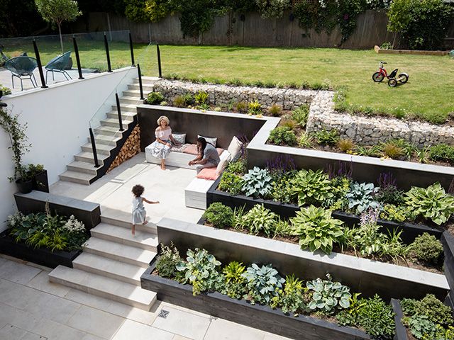 an outdoor garden area with stairs and plants